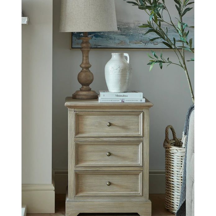 Delphine Collection 3 Drawer Bedside Chest by Hill Interiors showcasing a wooden furniture piece with sleek drawers and modern design.