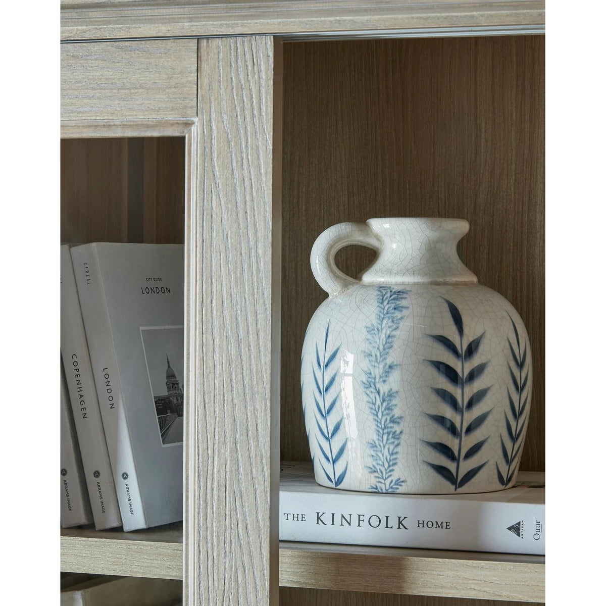 Sliding glass dresser top from Hill Interiors' Delphine Collection, showcasing sleek glass and modern furniture design.