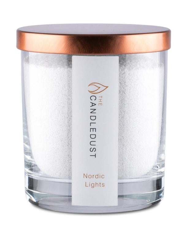 White scented candle in a sand jar from The Candledust Nordic Lights home fragrance kit, with a cozy, minimalist design.