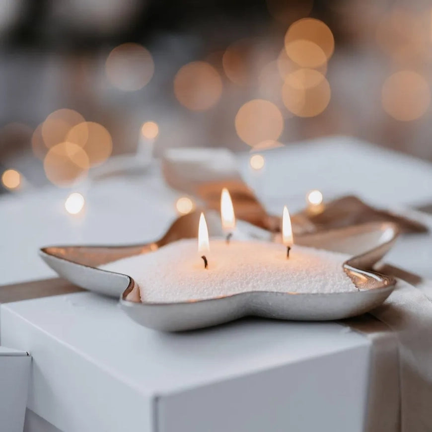 White scented candle sand kit for Midnight home fragrance by The Candledust, featuring a close-up of the candle and sand textures.