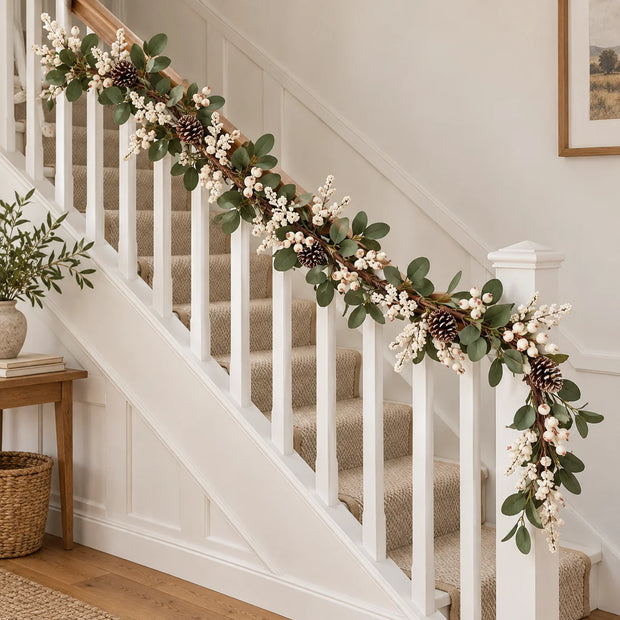 White berry and foliage garland on a staircase banister