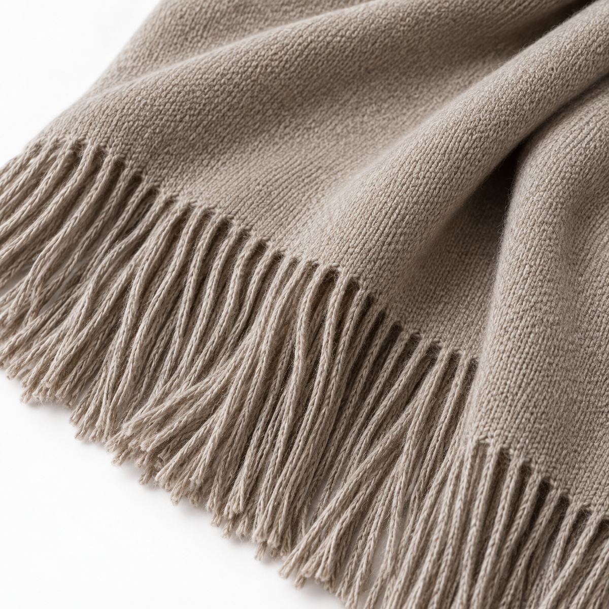 Ellenvale Trade beige and brown fine knit tasseled throw blanket, soft furnishings, showcasing cozy texture and decorative tassels.