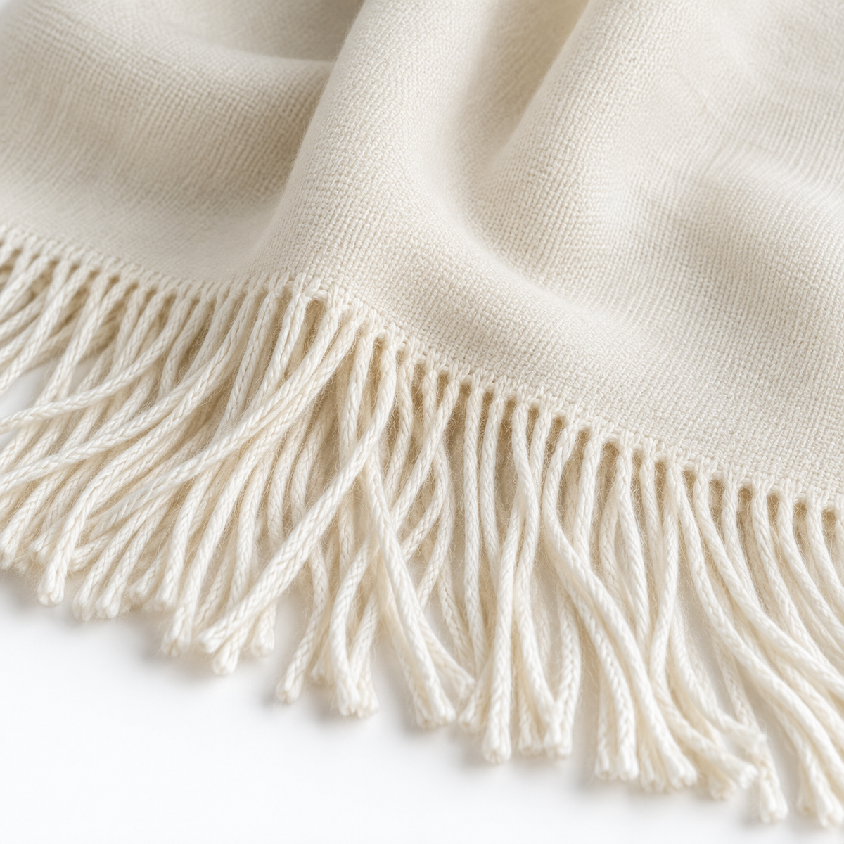 Ellenvale Della Cream luxury throw blanket with soft fine knit texture, perfect for cozy living room decor.