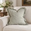 Hallie Sage Green Ruffled Edge Linen Cushion Cover – styled view 1