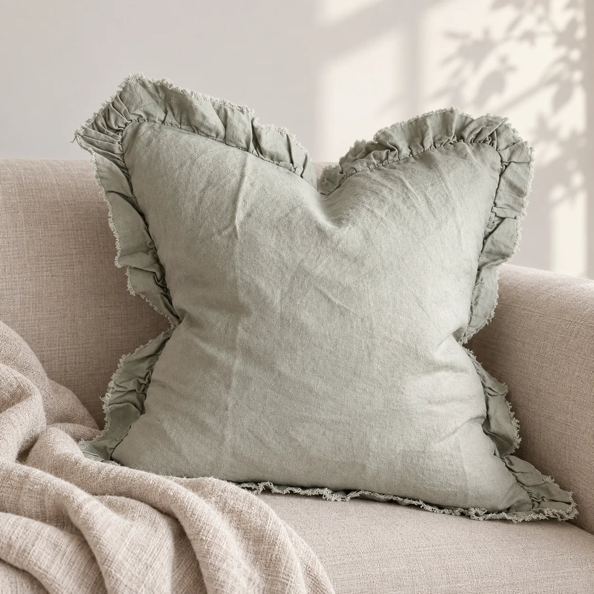 Hallie Sage Green Ruffled Edge Linen Cushion Cover – styled view 3