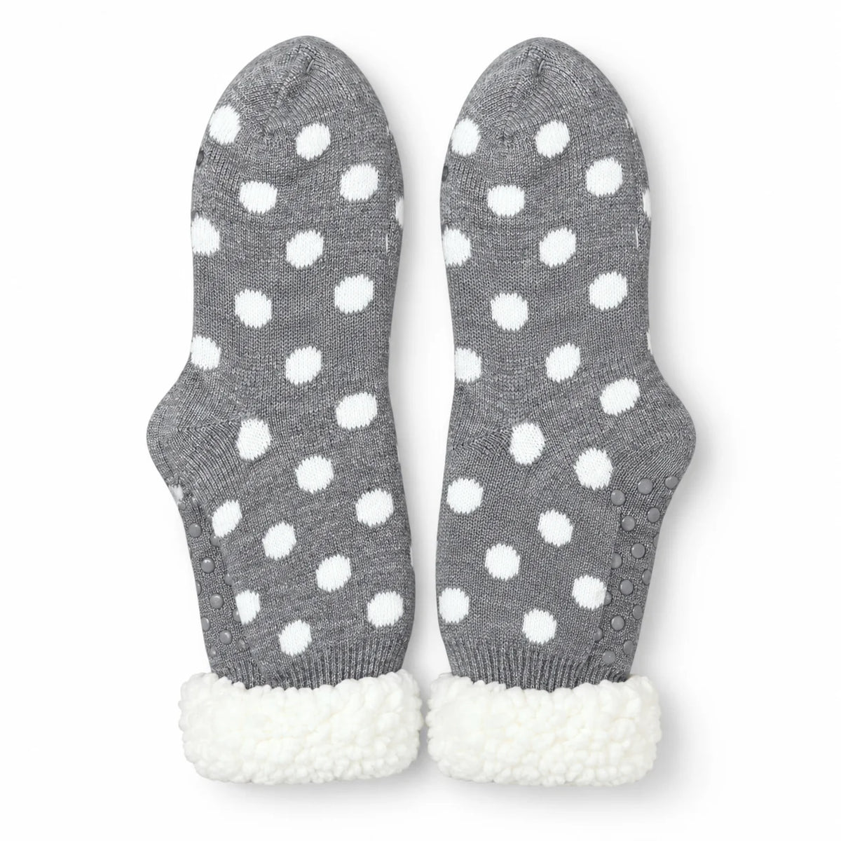 Pair of grey and white spot fleece-lined slipper socks on white