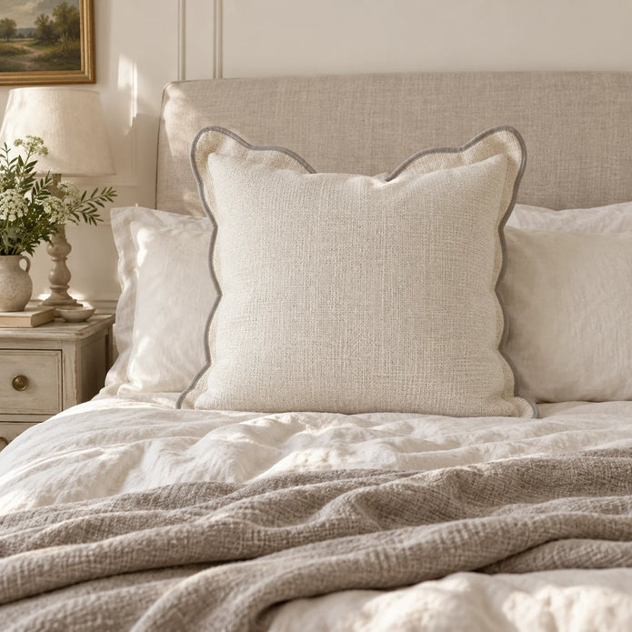 Chloe cream and greige 65 × 65 cm extra large bed cushion cover – styled on a bed, view 1