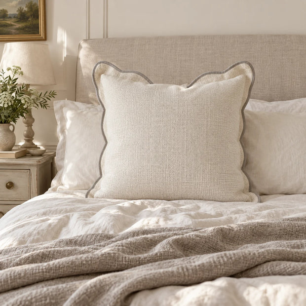 Chloe cream and greige 65 × 65 cm extra large bed cushion cover – styled on a bed, view 1