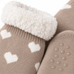 Close-up of taupe heart slipper sock knit, fleece lining and grip sole