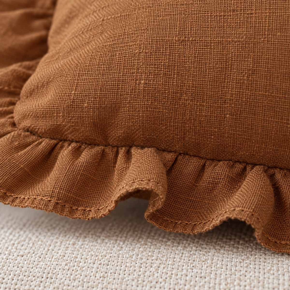 Rust brown linen blend cushion cover with frilled edges, rectangular shape, by Ellenvale Trade, suitable for soft furnishings.