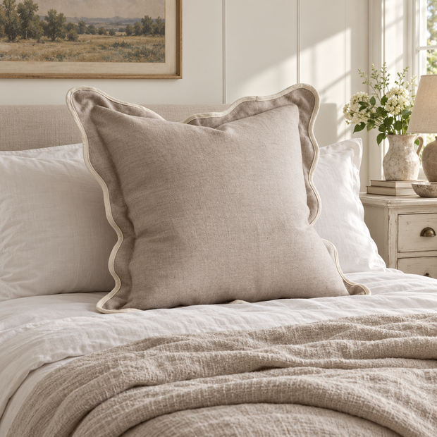 Chloe beige and cream 65 × 65 cm extra large bed cushion cover – styled on a bed, view 1