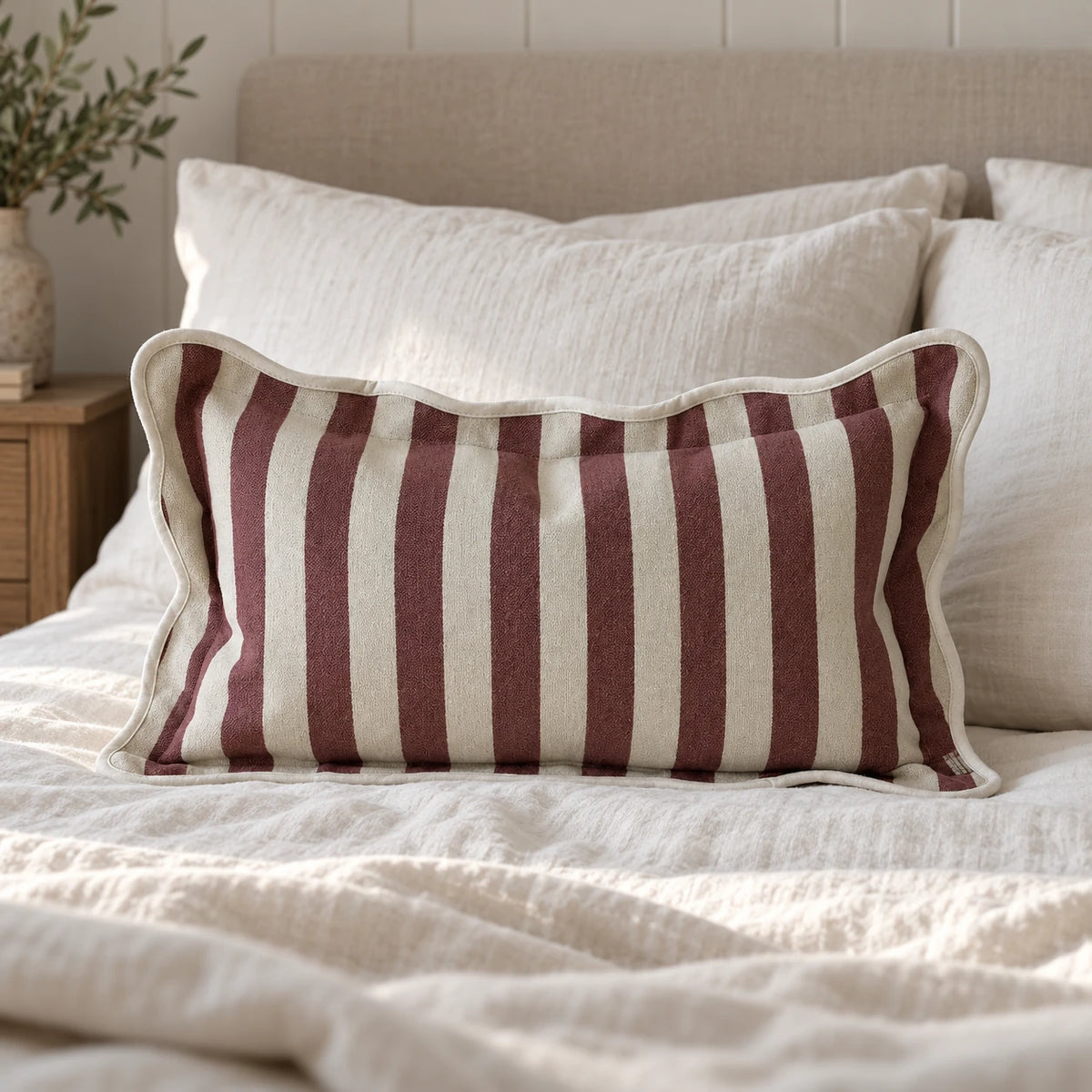 Ellenvale Chloe burgundy rectangle scalloped cushion cover on a bedroom cushion