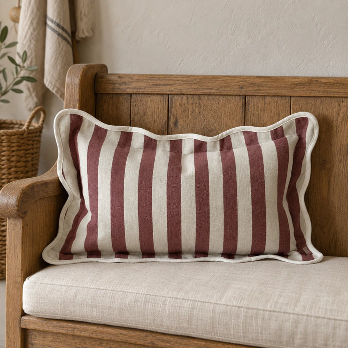 Ellenvale Chloe burgundy rectangle scalloped cushion cover on a country bench