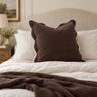 Chloe chocolate brown 65 × 65 cm extra large bed cushion cover – styled on a bed, view 1