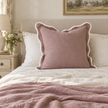 Chloe dusty pink 65 × 65 cm extra large bed cushion cover – styled on a bed, view 1
