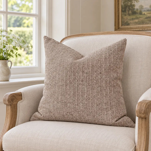 Ellenvale Eva beige striped cushion cover made of soft furnishings fabric, featuring a subtle striped pattern and a cozy design.