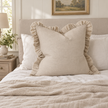 Grace beige 65 × 65 cm extra large bed cushion cover – styled on a bed, view 1