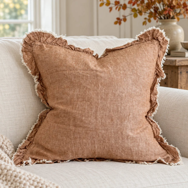 Ellenvale Hallie washed rust brown square cushion cover on a sofa