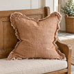 Ellenvale Hallie washed rust brown square cushion cover on a country bench