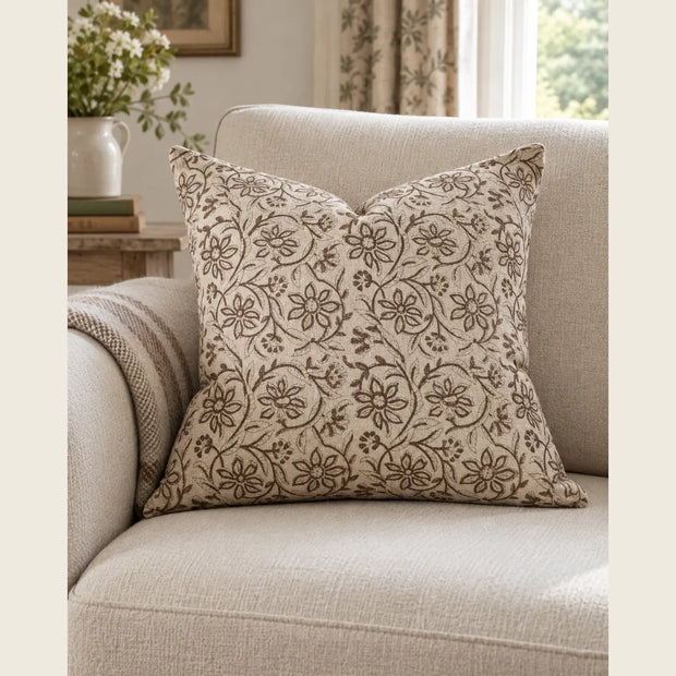 Ellenvale Ivy Brown floral print luxury cotton cushion cover showing a soft, decorative cushion with brown and floral patterns.