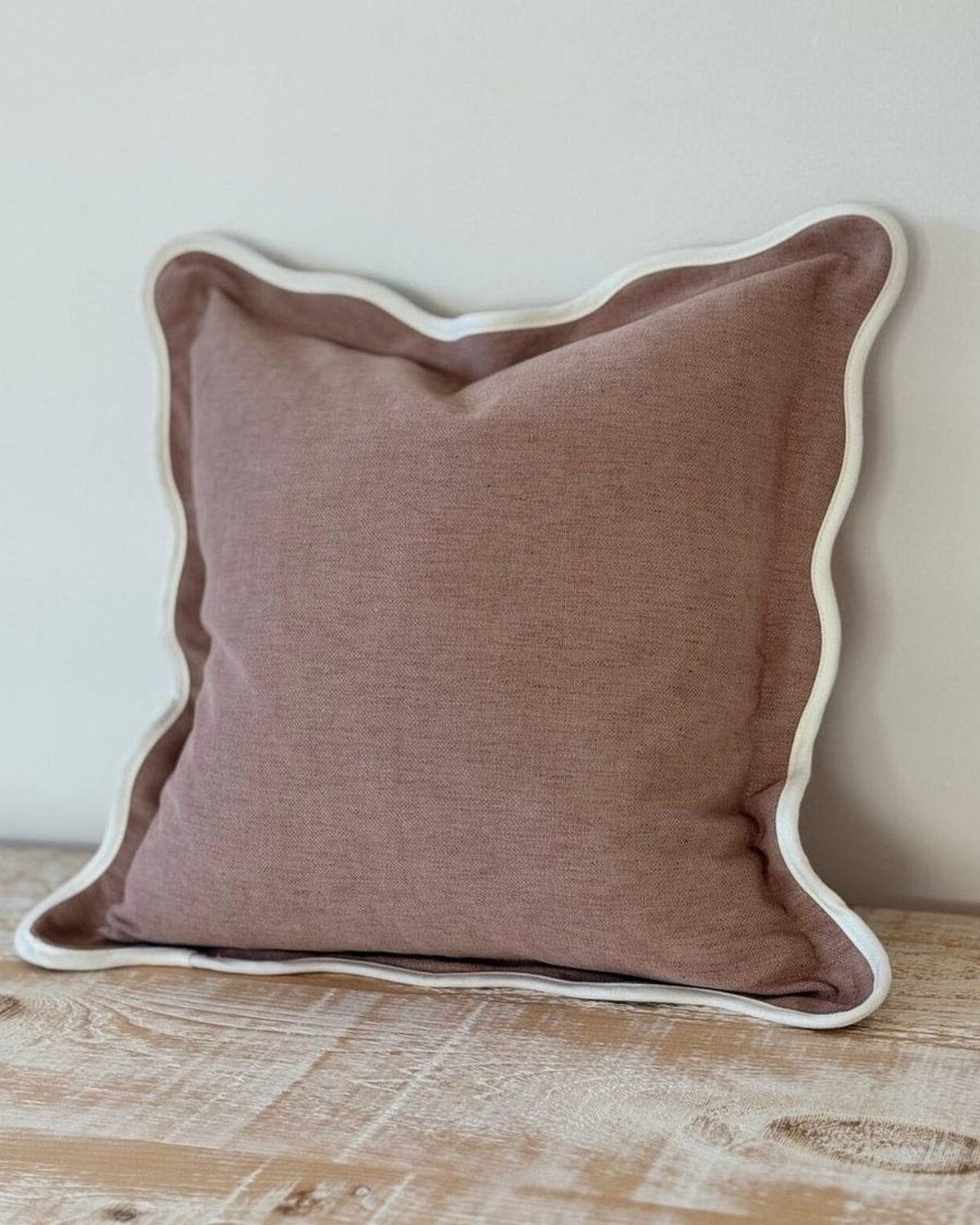 Dusty pink square scalloped cushion cover by Ellenvale Trade, soft furnishings accessory with decorative scalloped edges.