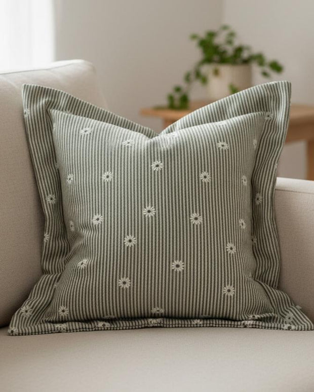 Olive green square cushion cover by Ellenvale Trade with daisy pattern, made from soft furnishings fabric, perfect for home decor.