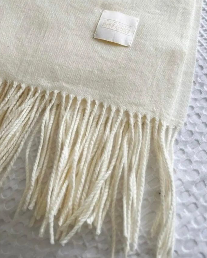 Della Cream soft luxury throw blanket by Ellenvale Trade with fine knit texture, cozy and elegant soft furnishings.