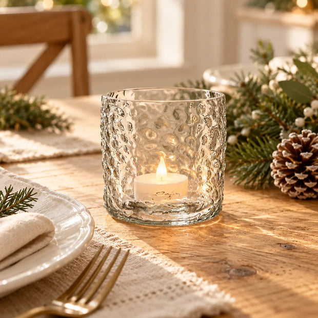 Esme clear glass lantern styled with a tealight beside a Christmas dining place setting.