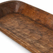 Close-up of the extra-large wooden dough bowl’s inner basin, showing wood grain and crosshatched carving marks.