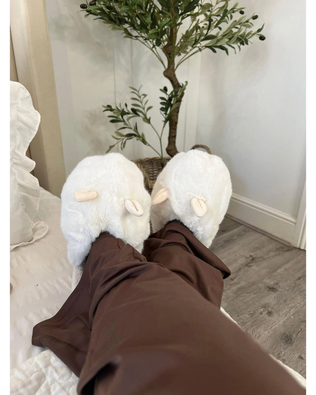 Oversized cream faux fur bunny rabbit slippers with plush texture, designed as cozy accessories by Fashion City.