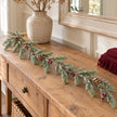106cm faux fir Christmas garland on a rustic oak console with neutral ceramics