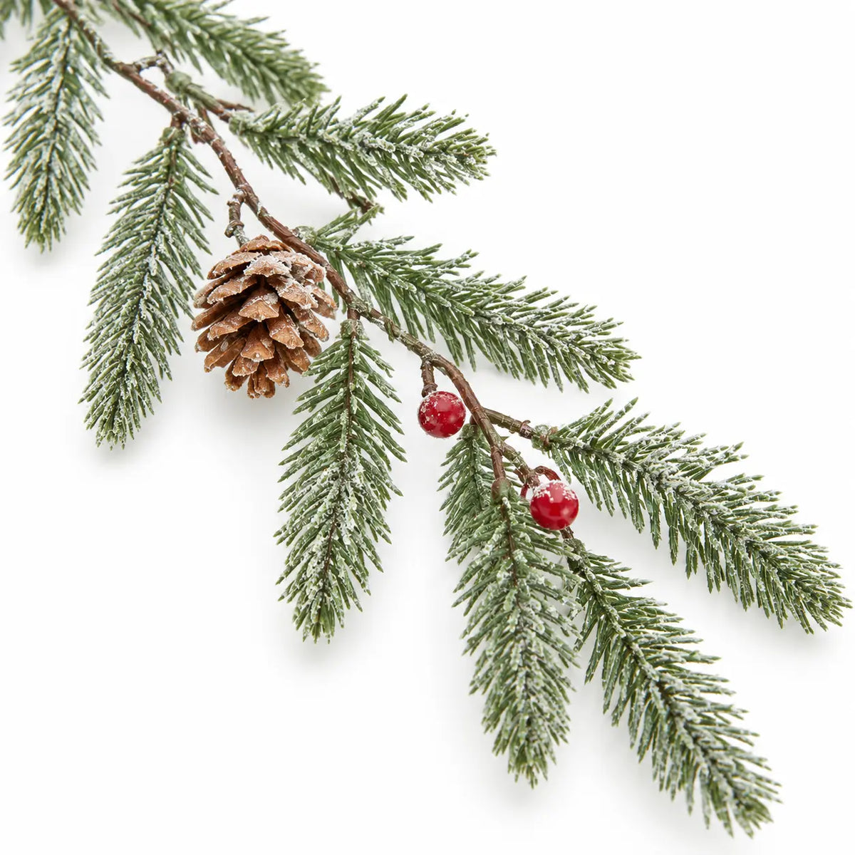 Close-up of lightly frosted fir needles, red berries and a pinecone on the artificial garland