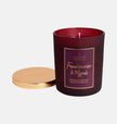 Frankincense and Myrrh Christmas jar candle by Shearer Candles with festive holiday design and warm glowing flame.