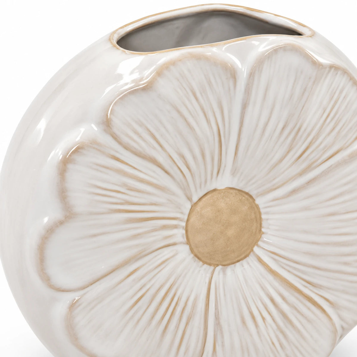 Close-up of sculpted petal grooves, beige flower centre and glazed finish on the small vase