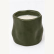 Forest green sculpted ceramic candle front view showing organic shape and white wax