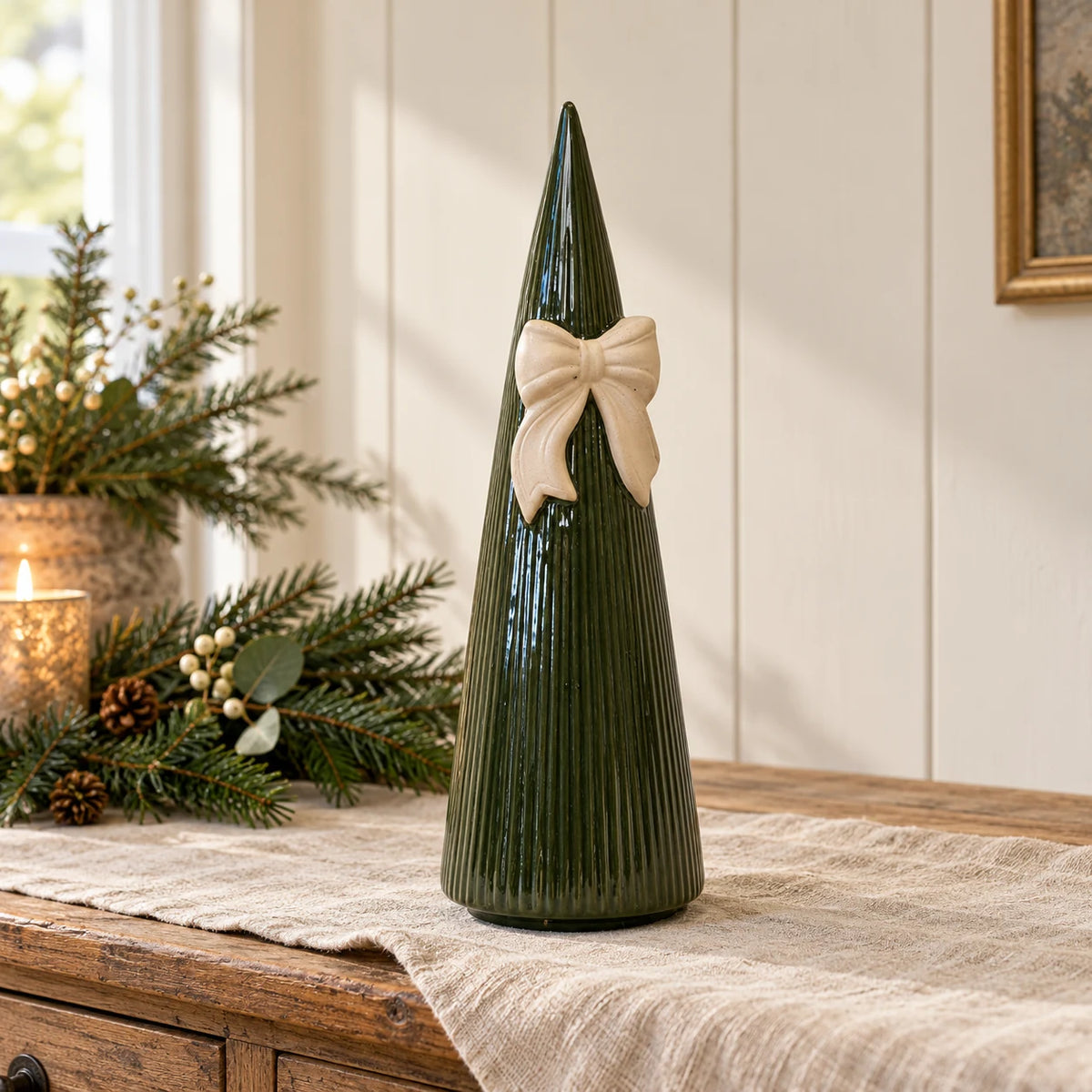 Satchville large forest green striped ceramic Christmas tree with bow, 32cm, styled on a table