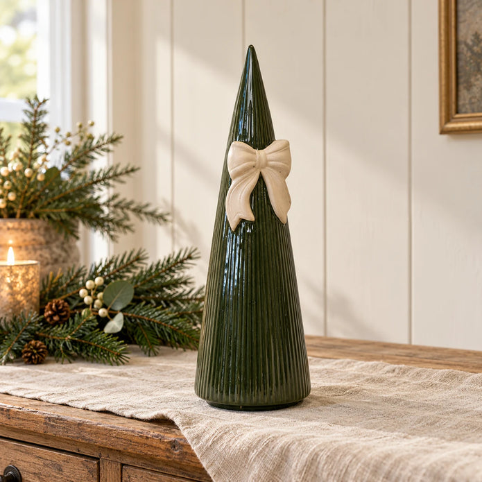 Satchville large forest green striped ceramic Christmas tree with bow, 32cm, styled on a table