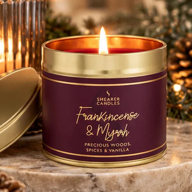 Shearer Candles Frankincense and Myrrh large tin candle in warm Christmas candlelight setting
