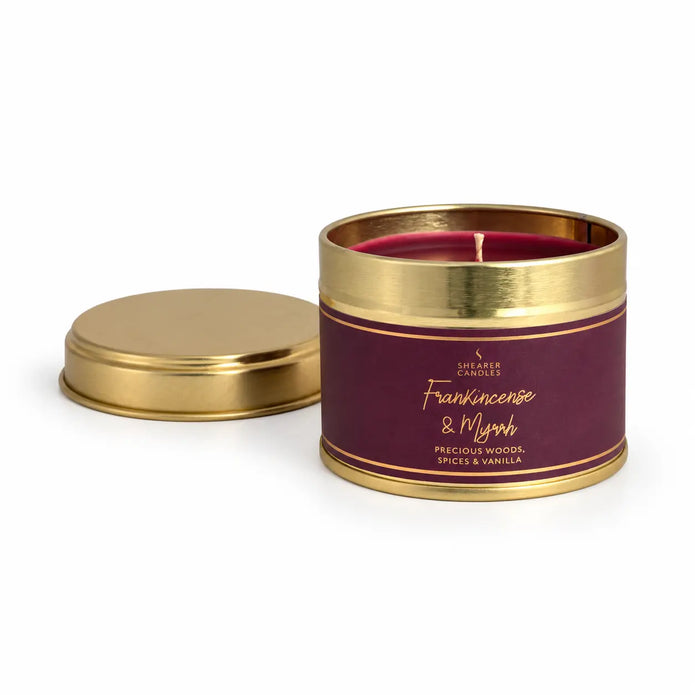 Small tin candle with frankincense and myrrh scent, perfect for Christmas, by Shearer Candles, featuring a festive holiday design.