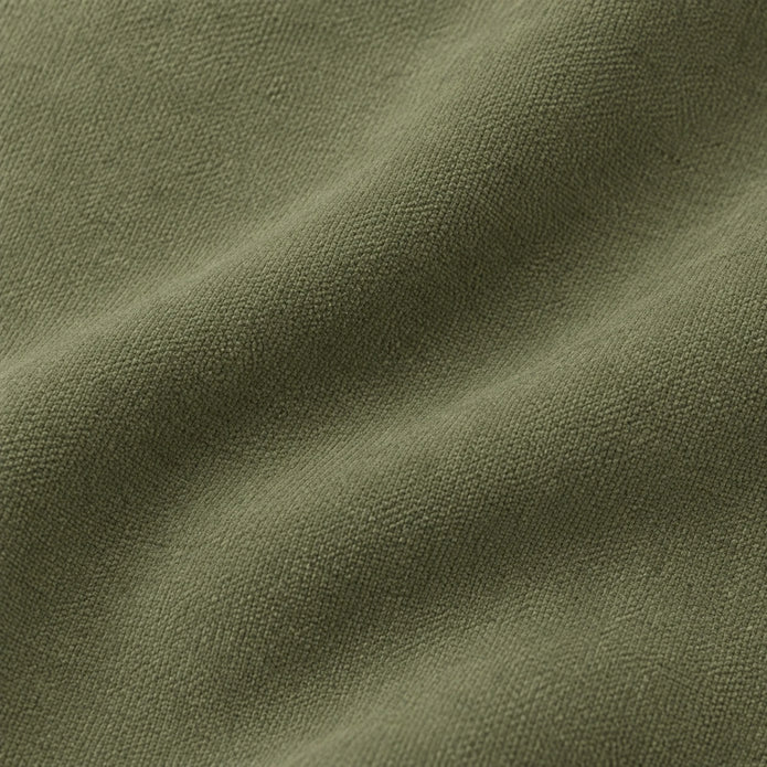 Frayed Edge Olive Green Cushion Cover, close-up of the plain olive fabric and fine woven texture.