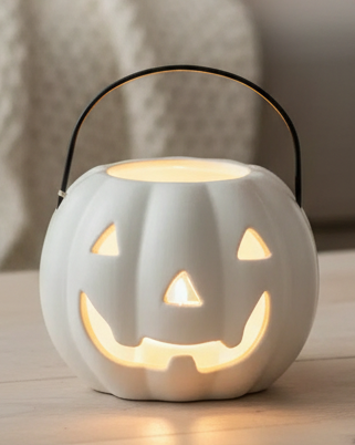 White Pumpkin Candle Holder, close-up of the smiling white pumpkin and dark handle