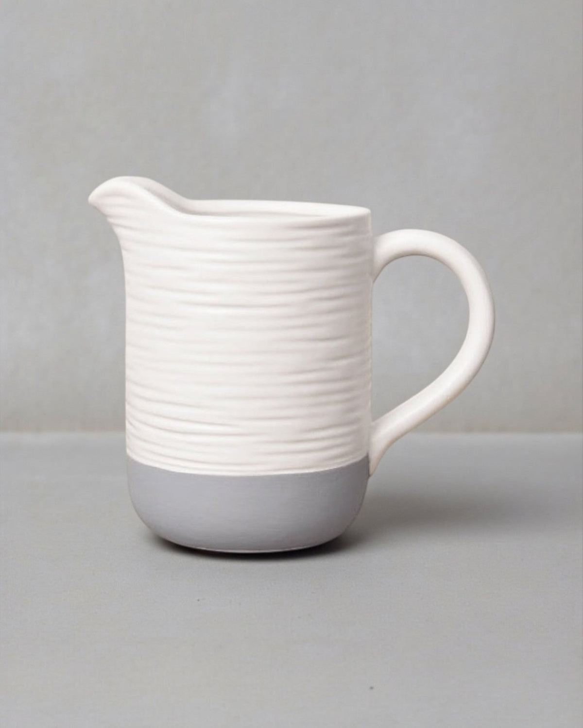 White and grey ceramic jug from Gainsborough Giftware, ideal for home décor with a sleek, modern design.