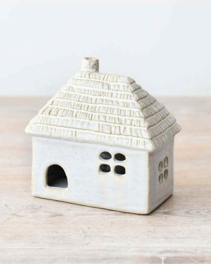 White LED light-up thatched roof cottage decor by Gainsborough Giftware, showcasing a charming miniature home with illuminated roof.
