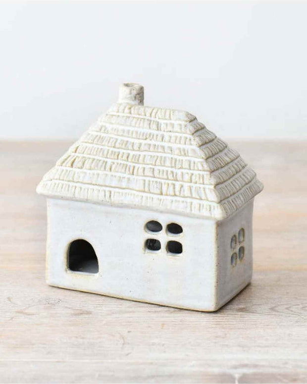 White LED light-up thatched roof cottage decor by Gainsborough Giftware, showcasing a charming miniature home with illuminated roof.