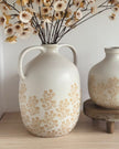 Artificial neutral spring flower stem in a white jug vase with floral pattern, by Gisela Graham, perfect for home decor.