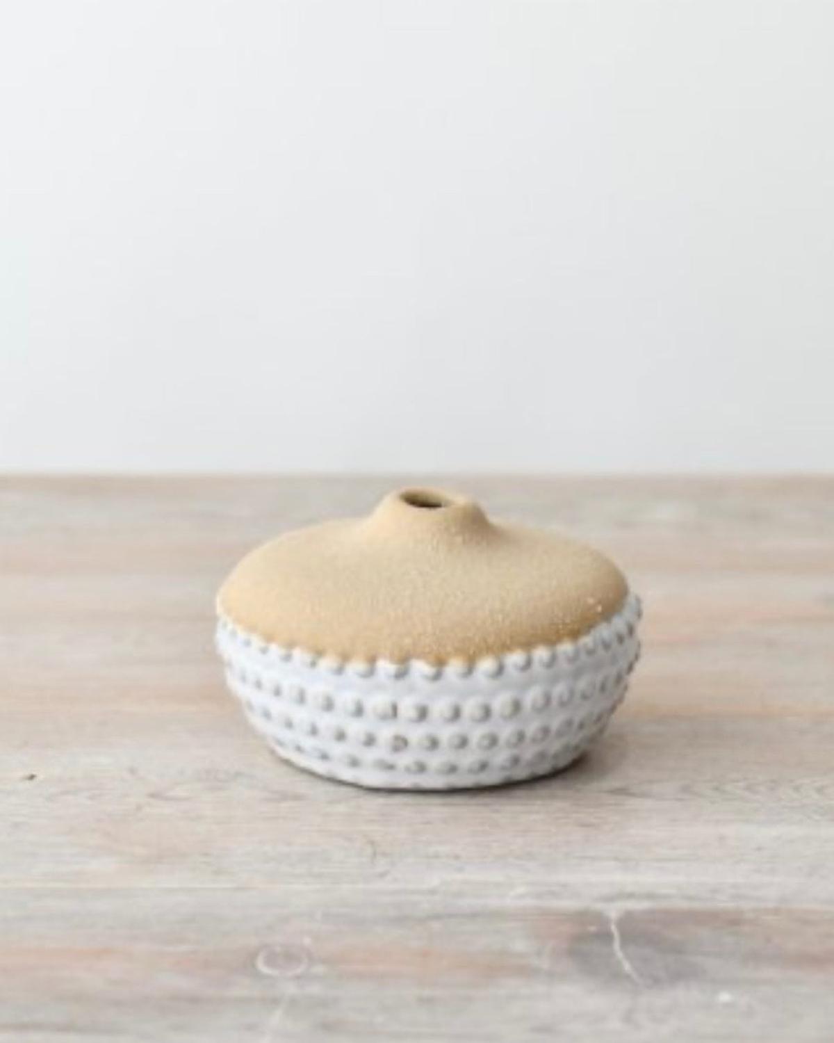 Neutral ceramic bobble vase by Gainsborough Giftware, showcasing a round, textured ceramic vase with a neutral finish.