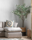 Extra large artificial faux olive tree by Gallery Direct, natural-looking green leaves and sturdy trunk in a decorative garden setting.