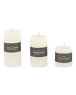 Set of three rustic cream LED battery-operated candles from Gallery Direct, showcasing soft glowing light and realistic flicker.