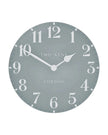 Thomas Kent 12-inch Arabic wall clock in flax blue featuring bold black Arabic numerals and a classic round design.