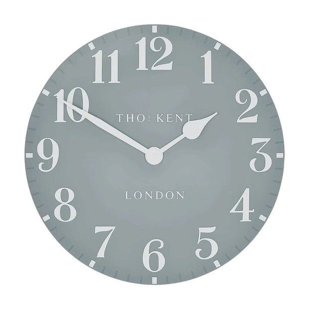 Thomas Kent 12-inch Arabic wall clock in flax blue featuring bold black Arabic numerals and a classic round design.